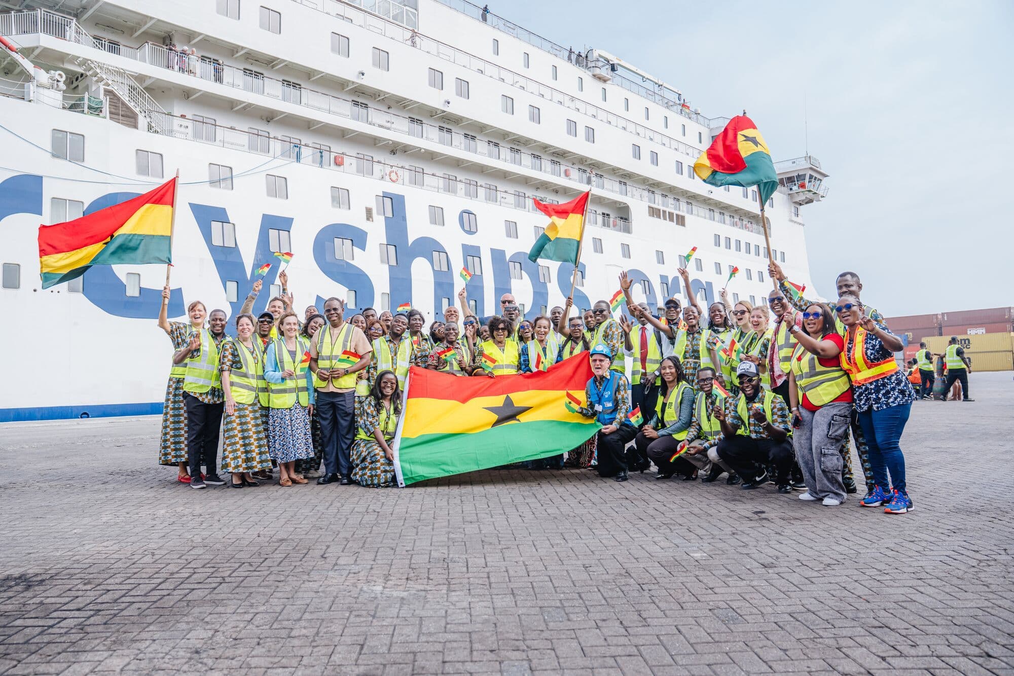 Mercy Ships staff and crew on the dock while the Global Mercy arrives at the Port of Tema in Ghana.